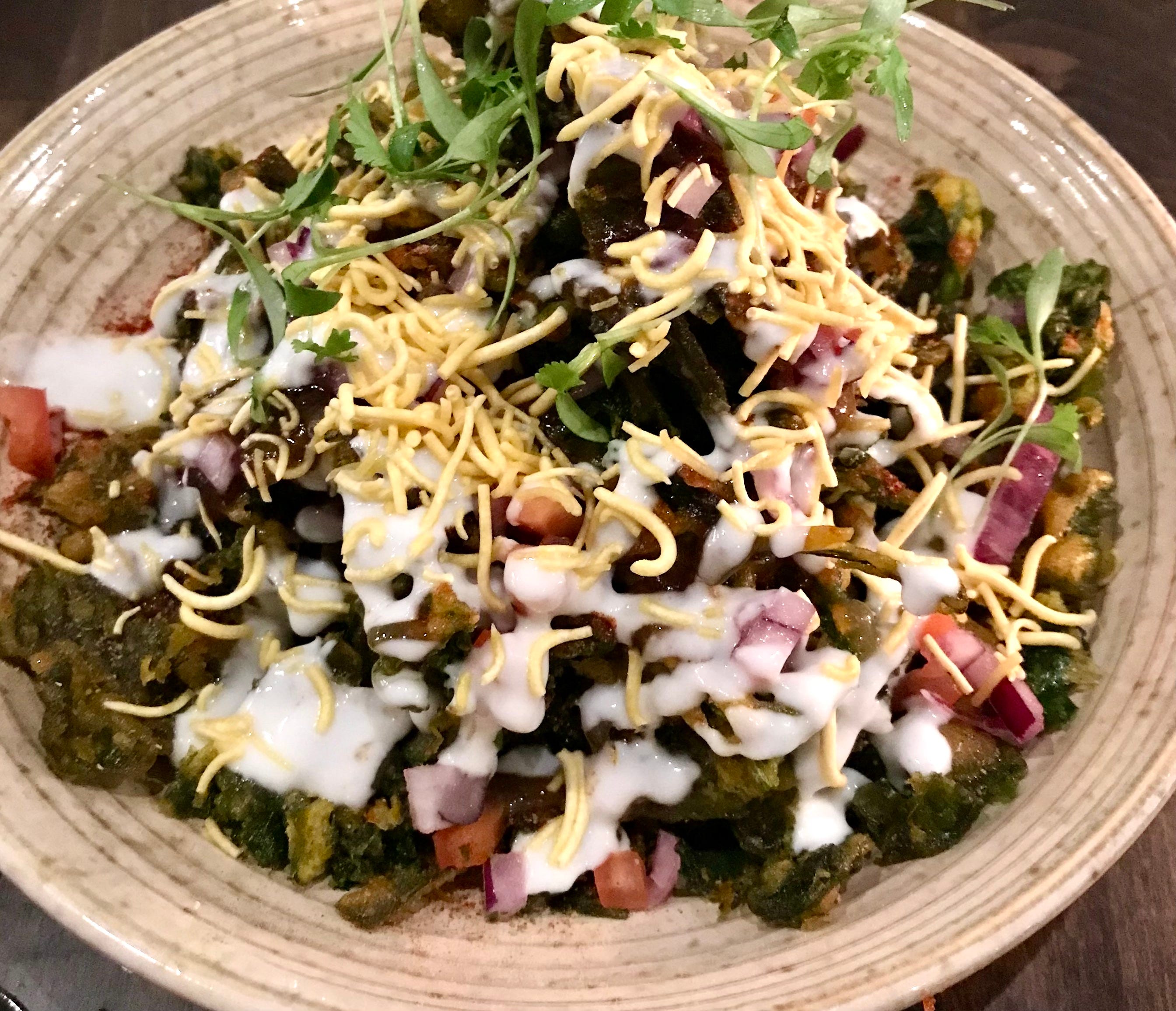 Spinach chaat, an appetizer at Saffron in the Third Ward, uses fried spinach instead of the typical fried dough. It's topped with mango chutney, chile lime dust, onion and yogurt.