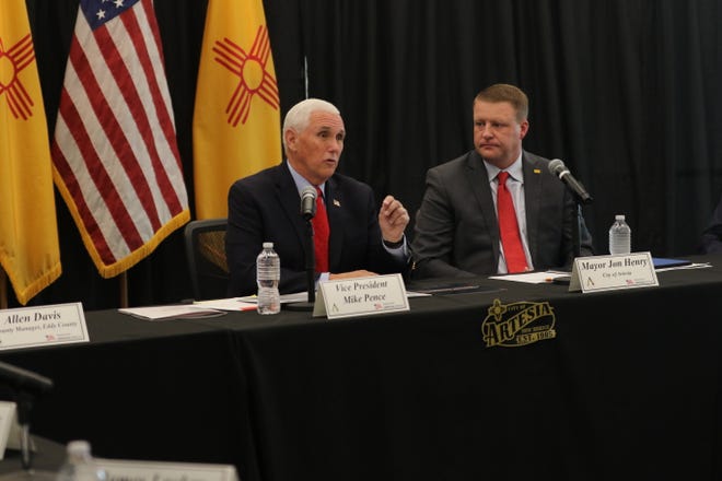 Former-Vice President Mike Pence (center) and Artesia Mayor Jon Henry speak about oil and gas production, Oct. 6, 2022 in Artesia.