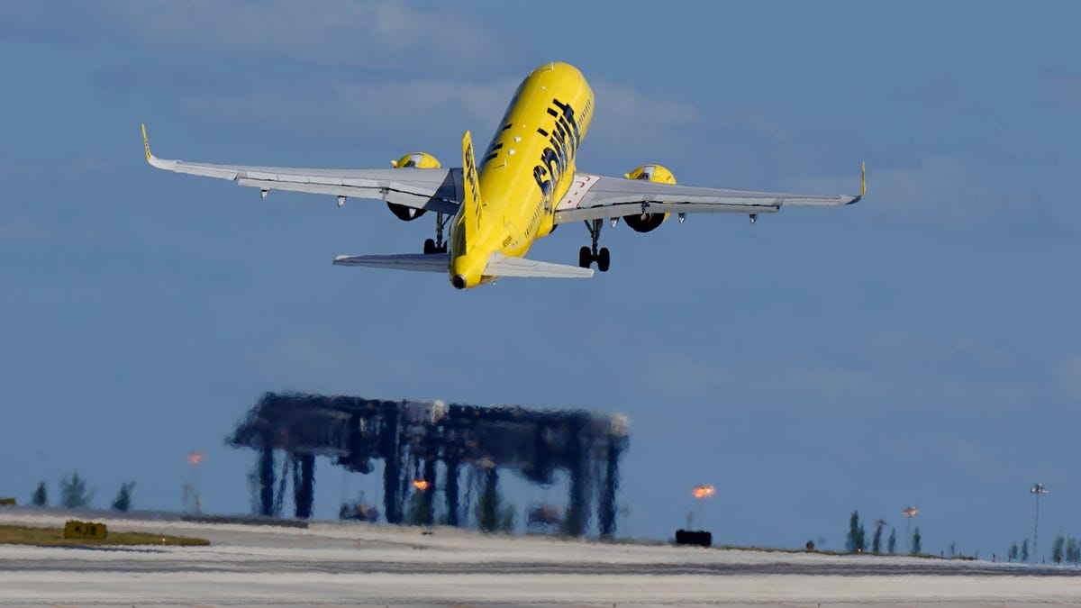 A Spirit Airlines Airbus A320 takes off from Fort Lauderdale-Hollywood International Airport, Tuesday, Jan. 19, 2021, in Fort Lauderdale, Florida. (AP Photo/Wilfredo Lee)