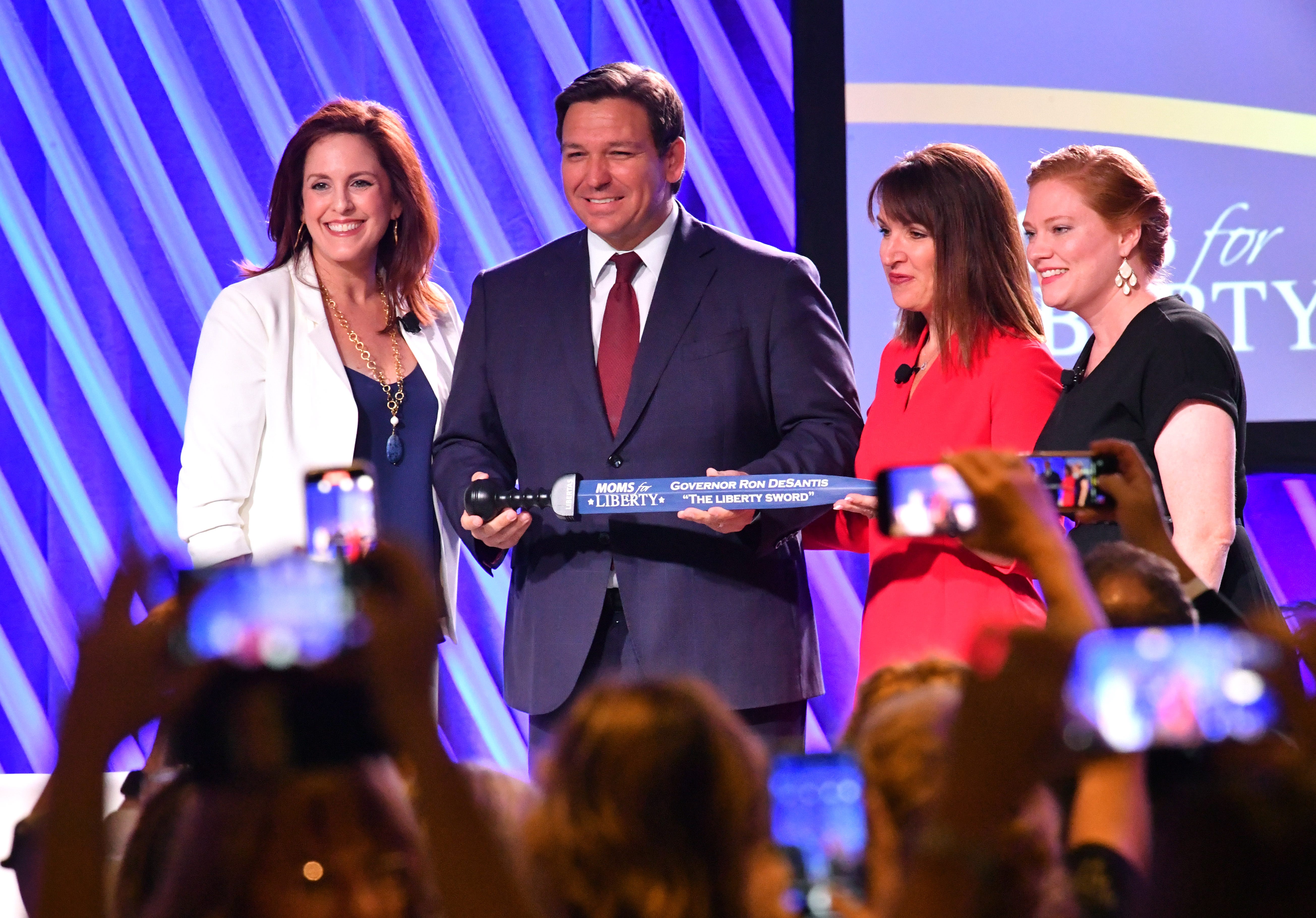 Florida Governor Ron Desantis, center, is presented 