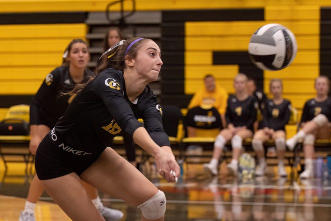 Garfield senior Madeline Shirkey sprints for the ball during Thursday night’s volleyball game against the Brookfield Warriors in Garrettsville.