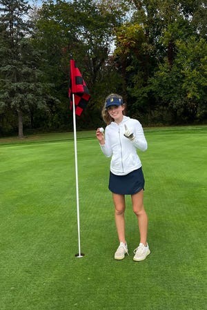 DeWitt sophomore Courtney Novak make a hole-in-one on the par-3 hole No. 4 at the Golf Club of Coldwater on Thursday, Oct. 6, 2022, during a Michigan High School Athletic Association Division 2 regional.