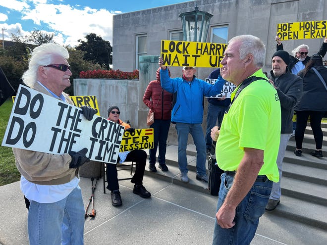 Harry Wait, right, confronts a group of people protesting Wait ahead of a court hearing in Racine County. Wait, of Union Grove, is charged with election fraud after he purposefully requested other people's ballots to prove voter fraud is possible.
