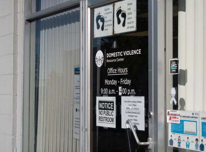 The front door shares office hours, rules and notices at the Domestic Violence Resource Center on Oct. 6, 2022, in Reno, NV.