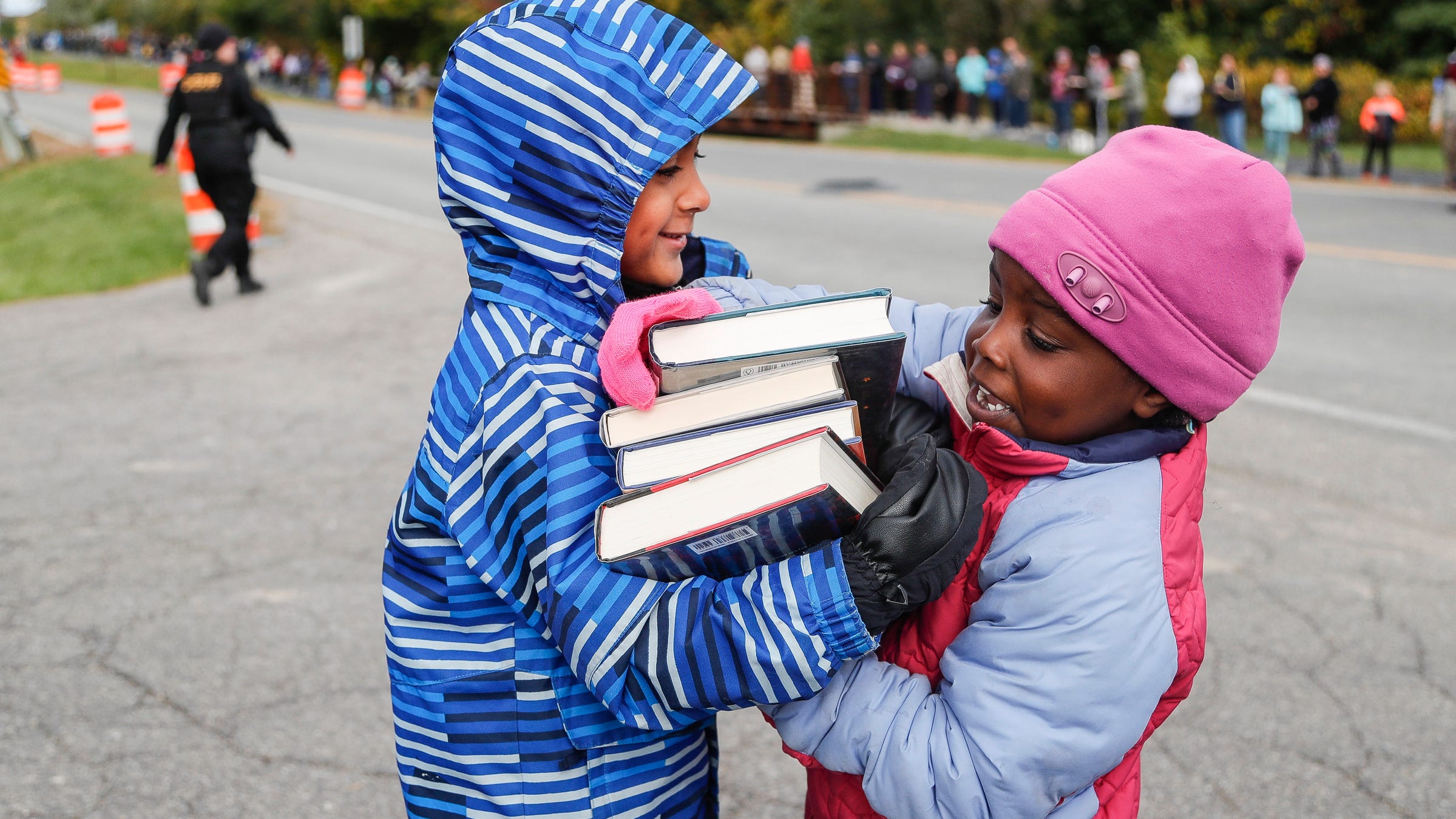 Human book chain helps Superior Township library move to new location