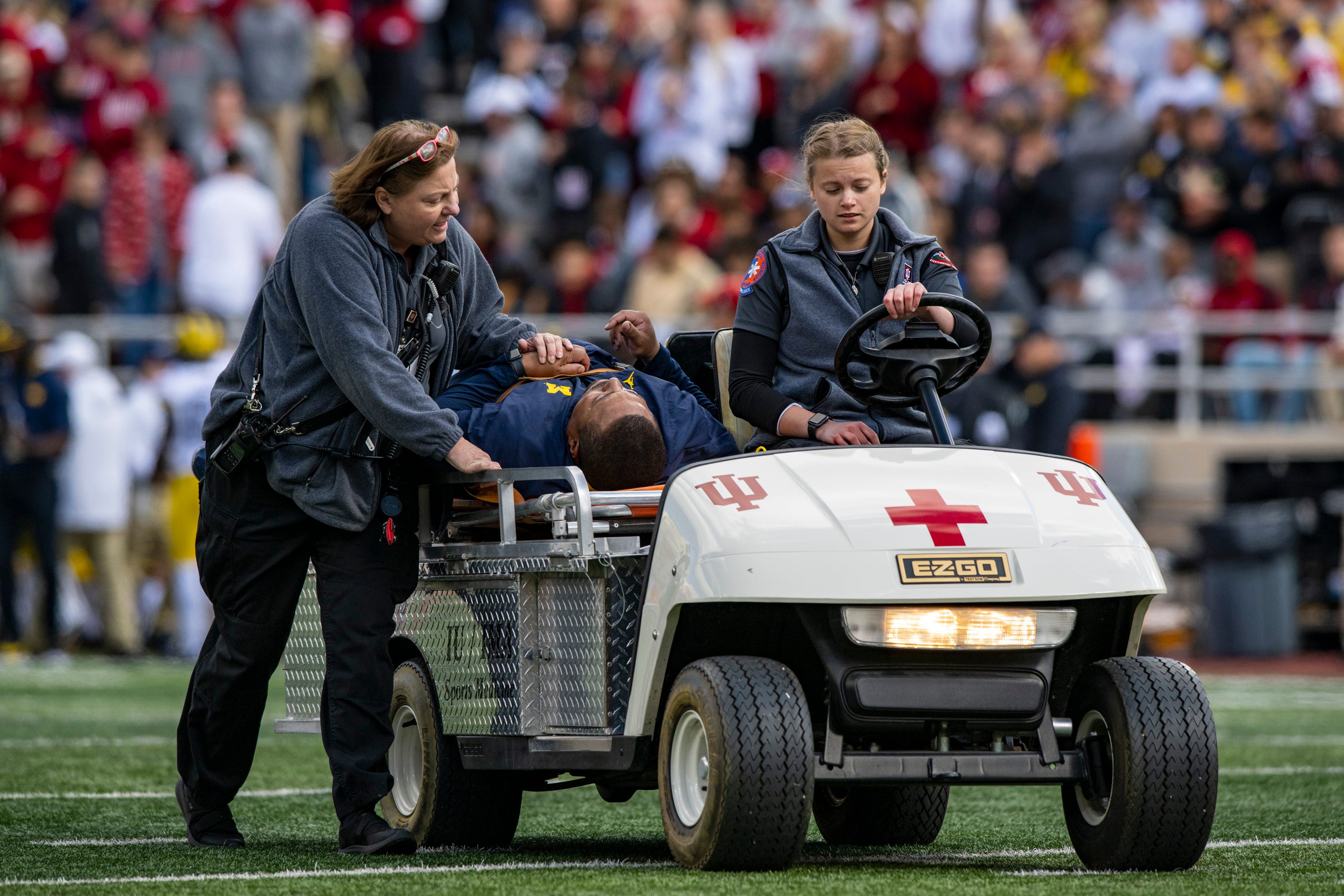 Michigan RB coach Hart in stable condition after collapsing on sideline