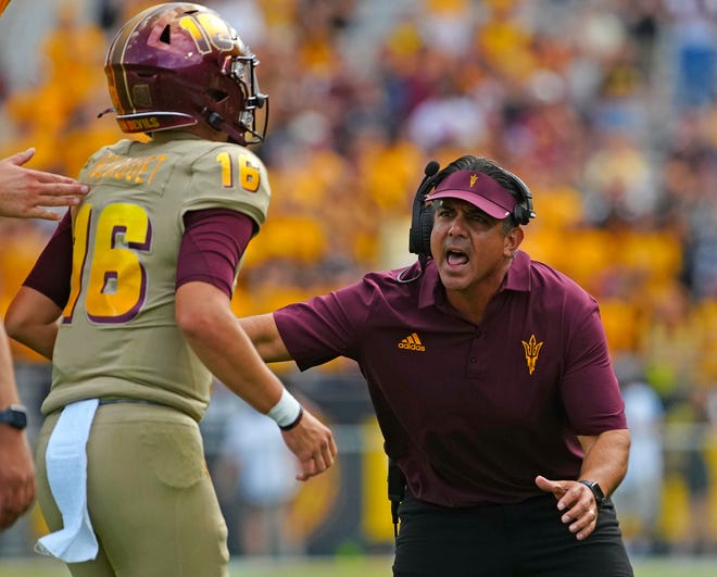 October 8, 2022; Chandler, Ariz; USA; ASU interim head coach Shaun Aguano celebrates with quarterback Trenton Bourguet (16) after a passing touchdown against Washington during a game at Sun Devil Stadium. Mandatory Credit: Patrick Breen-Arizona Republic
