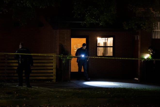 The Evansville Police Department search the scene of a reported stabbing at Mo's House in the 1100 block of Parrett Street in Evansville, Ind., Saturday evening, Oct. 8, 2022. 