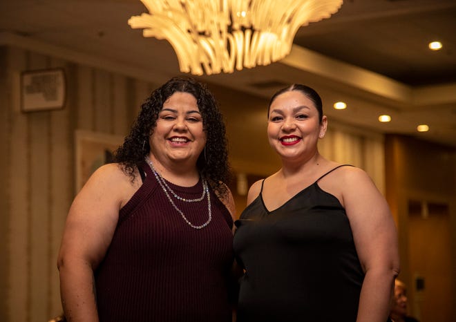 Benina Zavala, left, at an event celebrating the organization that helped her build her home in Coachella: the Coachella Valley Housing Coalition. At right is her neighbor, Adela Ayoa, who also helped build the home.