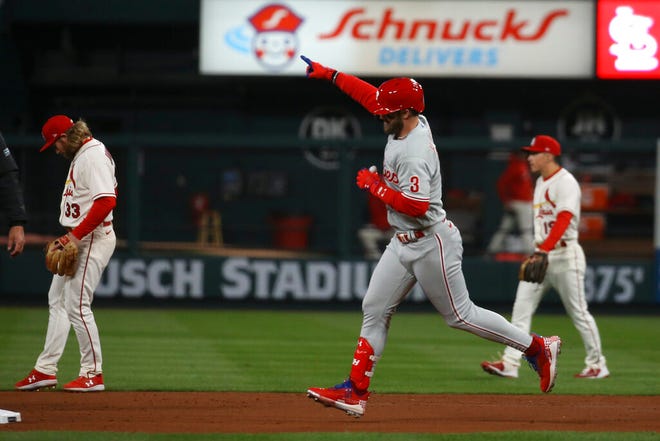 Philadelphia Phillies' Bryce Harper (3) reacts after hitting a solo home run during the second inning in Game 2 of a National League wild-card baseball playoff series against the St. Louis Cardinals, Saturday, Oct. 8, 2022, in St. Louis. (AP Photo/Scott Kane)