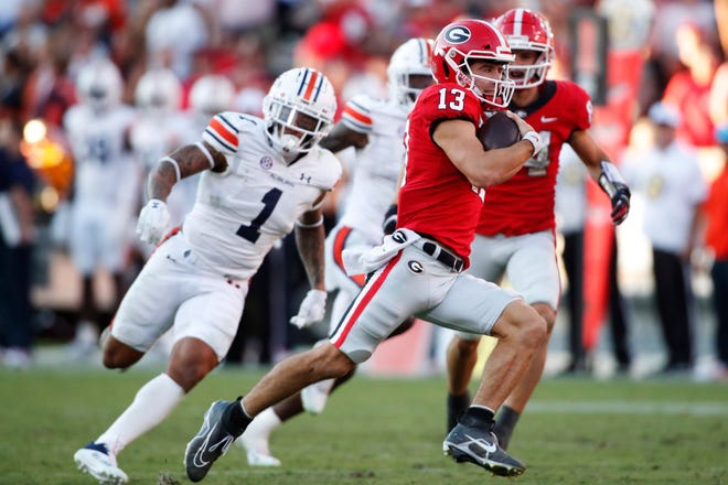 Georgia quarterback Stetson Bennett (13) breaks away for a long touchdown run during the second half of a NCAA college football game between Auburn and Georgia in Athens, Ga., on Saturday, Sept. 8, 2022. Georgia won 42-10.