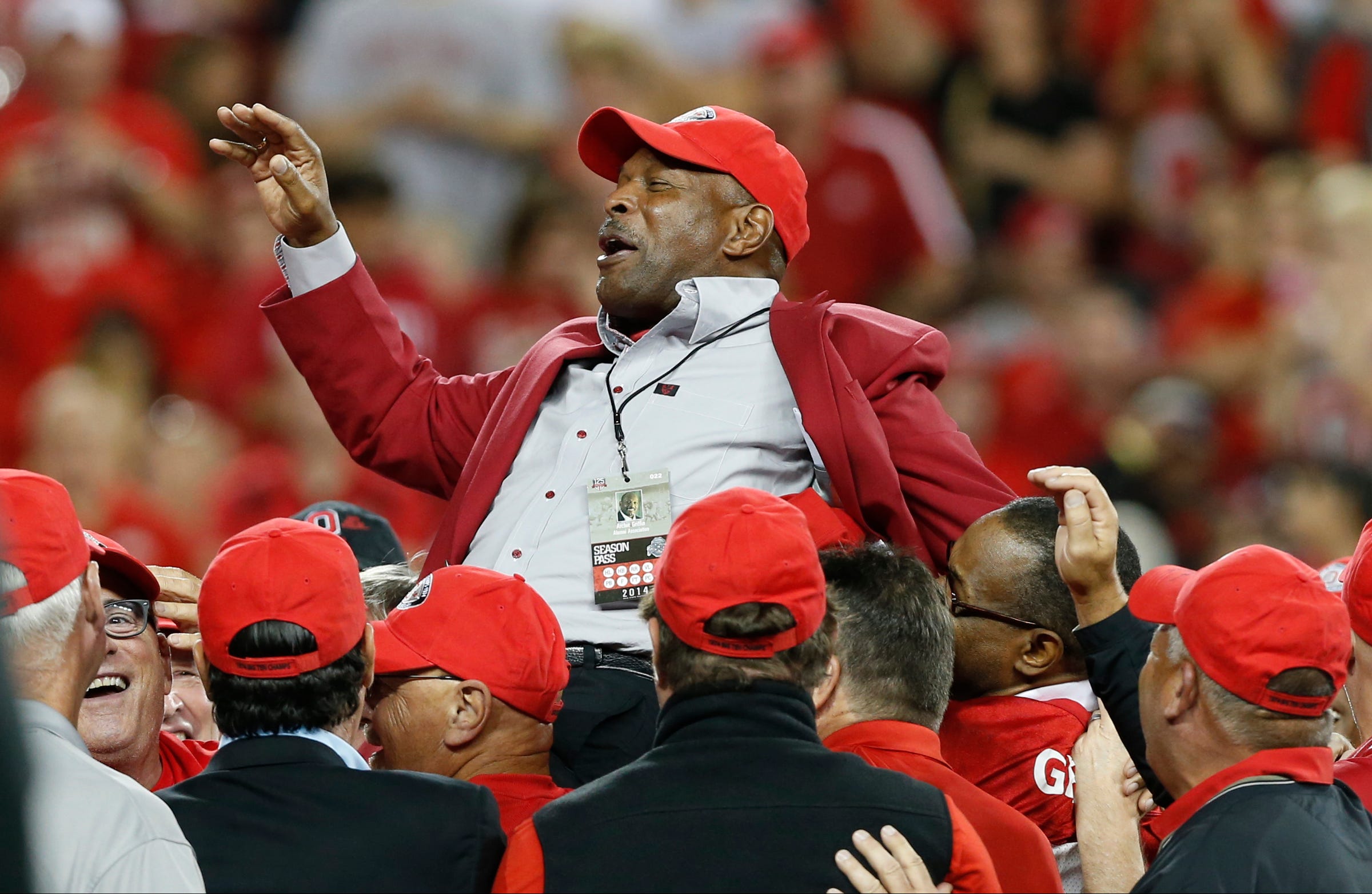 Archie Griffin is celebrated on the field of the anniversary of his first Heisman Trophy win during Saturday's NCAA Division I football game between the Ohio State Buckeyes and the Virginia Tech Hokies at Ohio Stadium in Columbus on September 6, 2014. (Dispatch Photo by Barbara J. Perenic) 