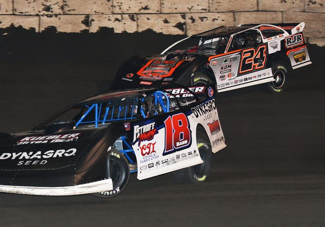 Shannon Babb (18) leads Ryan Unzicker in the 40-lap, MARS Late Model feature race Friday, Oct. 7. Babb went on to win his second feature race of the year.