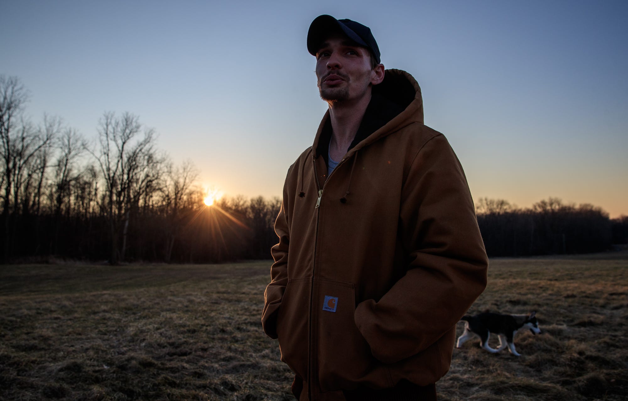 Tanner McAfee walks through a field with his dog, Meeka, behind the home he recently purchased in Michigan. He's proud of the home for which he spent 10 years saving. The RV industry was good for pay, he says, but bad for his body. McAfee left the industry for a while earlier this year, saying he doesn't want to pay for a knee replacement before he's 40. "I just started working with my buddies who've been trying to get me to work with them for a year now," he said. "It's not as much money but I don't have to kill myself everyday."