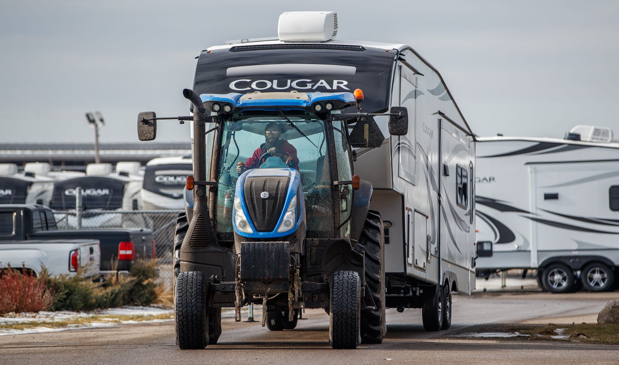 A Keystone worker pulls an RV to a different location earlier this year.