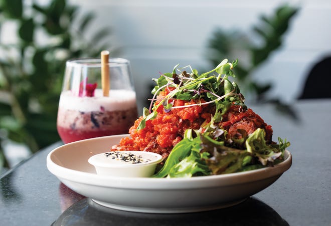 Cauliflower wings and a Lilac Ophelia cocktail at Greenhouse Canteen & Bar, 1011 W. Fifth Ave., in Columbus’ Fifth by Northwest neighborhood.