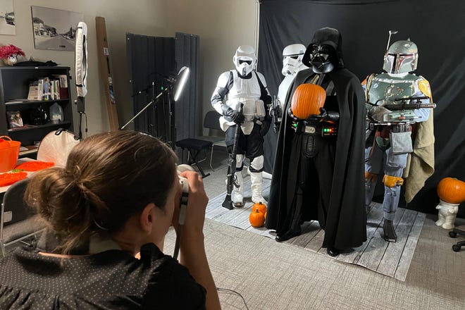 Photographer Julie Wright-Gonzales photographs members of the Star Wars-based 501st Legion in the photo and video studio at the Fort Walton Beach Library during an open house held on Monday.