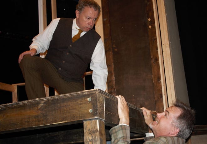 In this scene from "The Play That Goes Wrong, Thomas Colleymore, right, (played by Mike Krcil) is trying to get onto an upper platform where inspector Carter (played by Johnny Molson) is.
