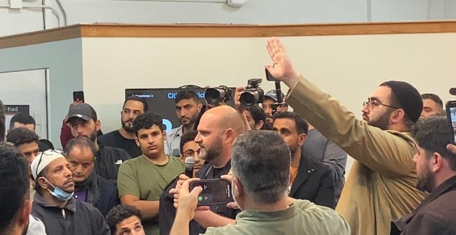 Dearborn Police Chief Issa Shahin spoke at about 9:10 pm Oct. 10, 2022, after the Dearborn Public Schools board meeting ended, trying to calm the crowd down. "Please, calm down, let's have respect for each other. ... Dearborn is better than this."