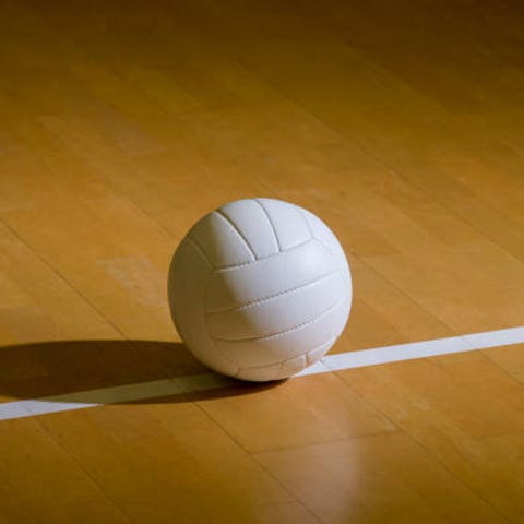 Volleyball court wooden floor with ball on black w