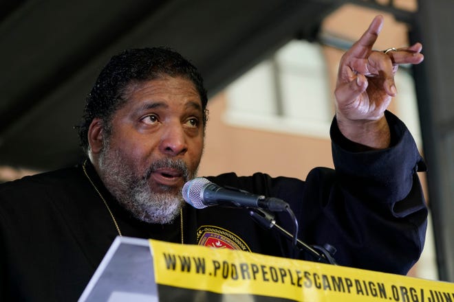 Rev. William J. Barber II, Poor People's Campaign founder and co-chair, speaks during a Moral Monday rally, held by the campaign, outside of the Governor's Mansion in Jackson, Miss., Monday, Oct. 10, 2022. (AP Photo/Rogelio V. Solis)