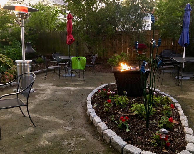 Grab a table next to the fire for drinks with friends at Bellefonte Cafe.