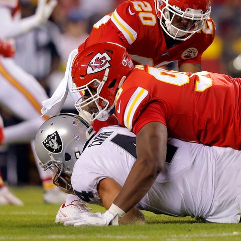 Raiders QB gets sacked by Chiefs defensive tackle 