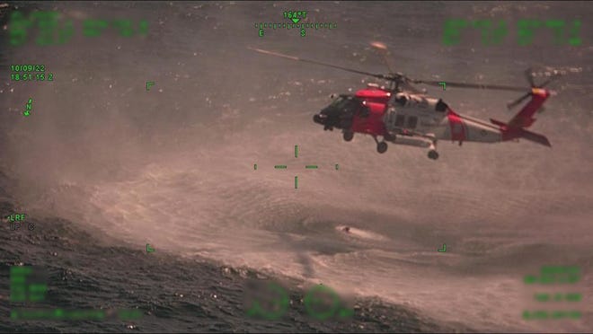 The Coast Guard came up clutch on Sunday, rescuing three stranded people whose boat had sunk.