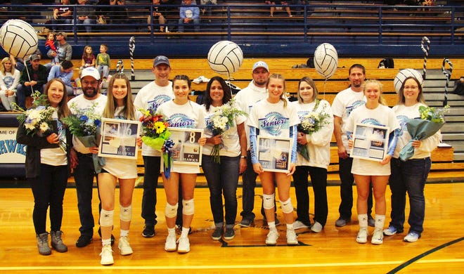 It was Senior Night on Oct. 11 at Prairie Central High School and four members of the volleyball team were recognized before their match with St. Joseph-Ogden. The four seniors honored were, in front from left, Emmy Bell (with parents Eric and Amy Bell), Alexandria Hari (Art and Steph Hari), Haley O'Brien (David O'Brien and Marie Wiser) and Reily Young (Rick and Becky Young).