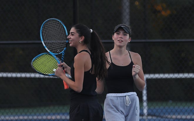 From left, Byram Hills' Chloe Bernstein and Jenna Kleynerman cheer a point during their doubles match against Harrison's Hannah Rose and Alexia Lansberg during the Section 1 girls tennis finals at Harrison High School Oct. 11, 2022. 
