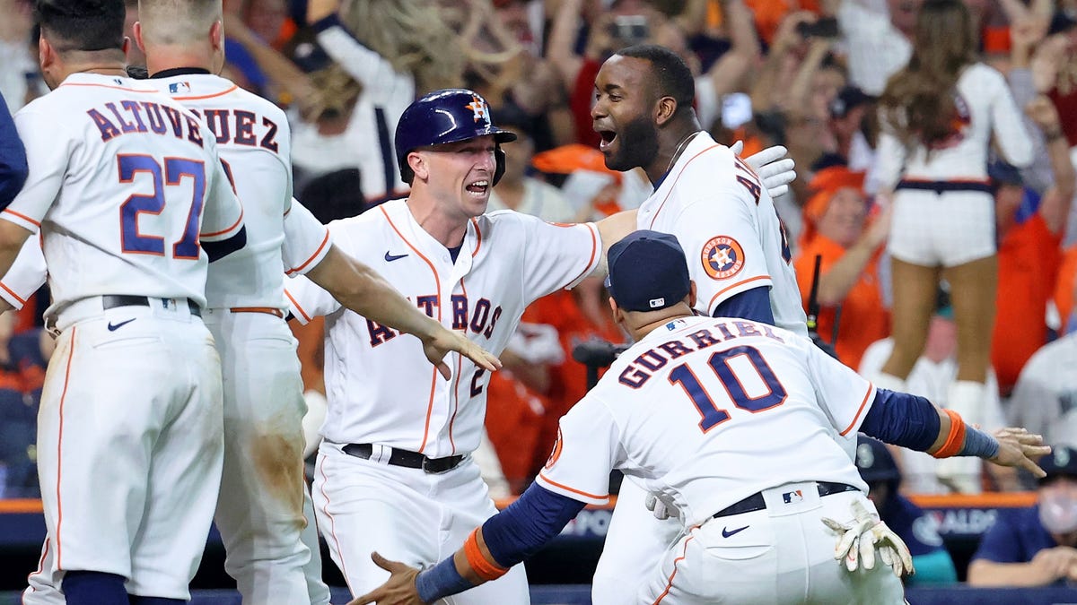 Astros' Yordan Alvarez celebrates after after hitting a walk-off three-run home run against the Mariners in the ninth inning.