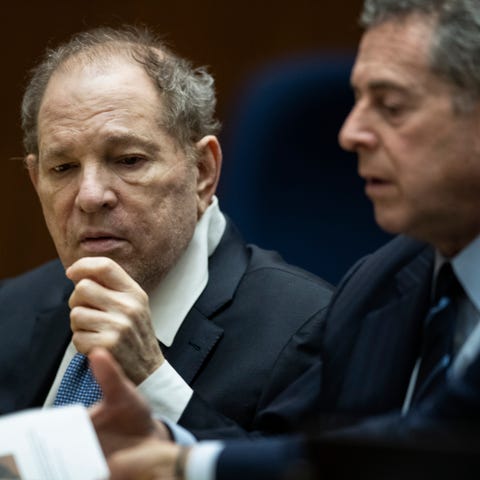 Former film producer Harvey Weinstein, left, inter