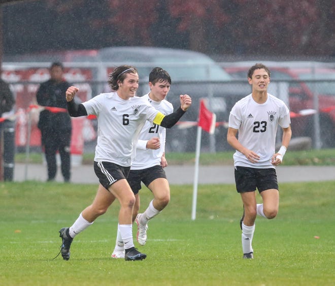Penn’s Carter Utz (6) celebrates after a goal during Wednesday night’s regional game at Goshen.