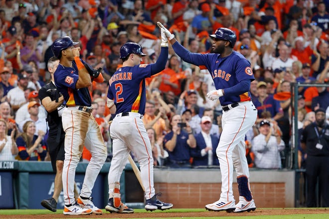 Oct 13, 2022; Houston, Texas, USA; Houston Astros left fielder Yordan Alvarez (44) is congratulated by third baseman Alex Bregman (2) after hitting a two-run home run against the Seattle Mariners during the sixth inning of game two of the ALDS for the 2022 MLB Playoffs at Minute Maid Park. Mandatory Credit: Troy Taormina-USA TODAY Sports