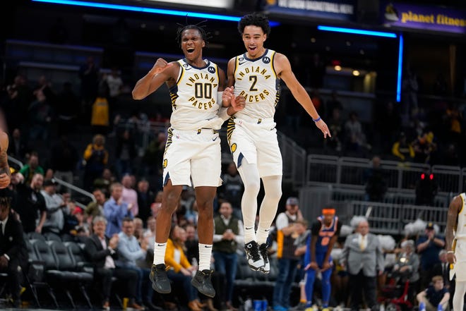 Indiana Pacers' Bennedict Mathurin (00) and Andrew Nembhard (2) celebrate during the second half of the team's NBA preseason basketball game against the New York Knicks, Wednesday, Oct. 12, 2022, in Indianapolis.