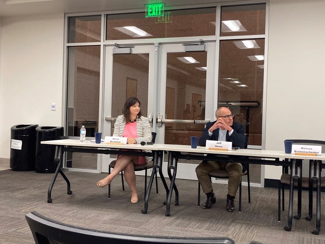District 13 Senator Alyssa Brickman and incumbent Jeff Howe listen at the District 13 Candidate Forum on October 12, 2022 at the Sartell Community Center.
