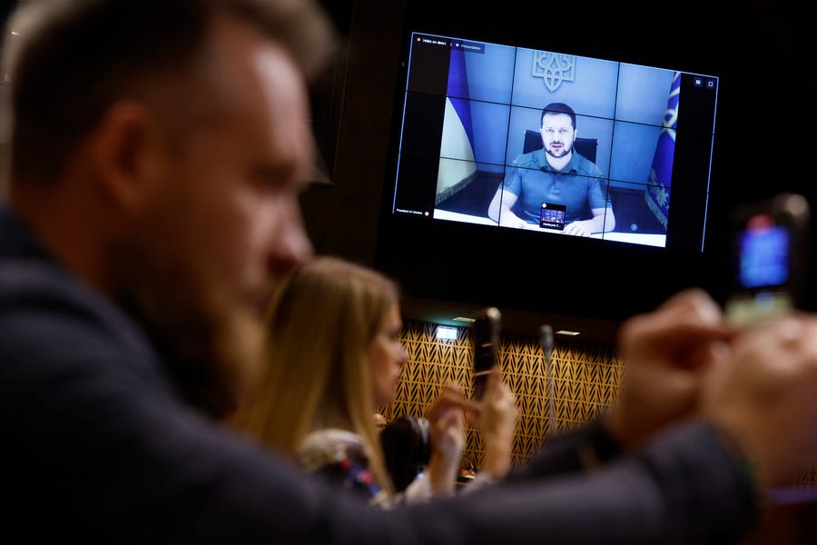 Ukrainian President Volodymyr Zelenskyy speaks during a video address to the European Council, Thursday, Oct. 13, 2022 in Strasbourg, eastern France. Ukraine's capital region was struck by Iranian-made kamikaze drones early Thursday, officials said.