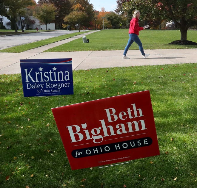 Beth Bigham, the Republican candidate running for the Ohio House seat in the 34th District, campaigns in Stow as she passes signs supporting her and her friend Kristina Daley Roegner, who is running for Ohio senate.