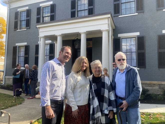 Owners Drew Musser and Steph Moore (left) thanked original owners Bob and Nancy Biggs for providing photos to help restore the historic building.