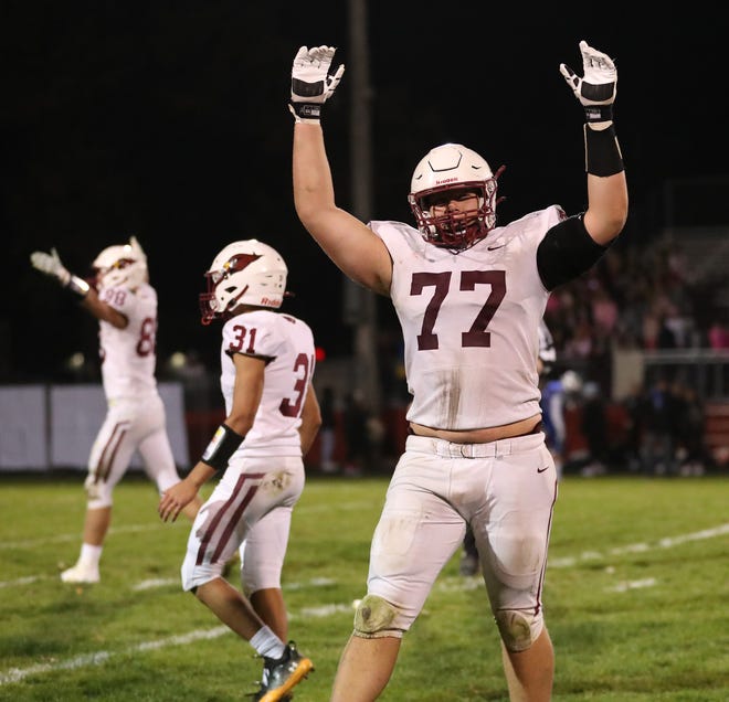 Mayville's Hewsten Steger (77) celebrates during the closing minute of the Cardinals' victory over St. Mary's Springs on Oct. 13.