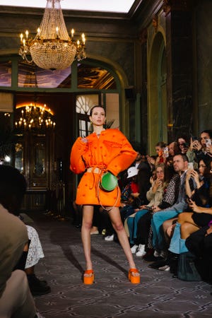 A model wears a Honeymouth bag on the runway at Paris Fashion Week.  Honeymouth is owned by creative director Georgia Vogel, and the Old City store operates with a full female staff.