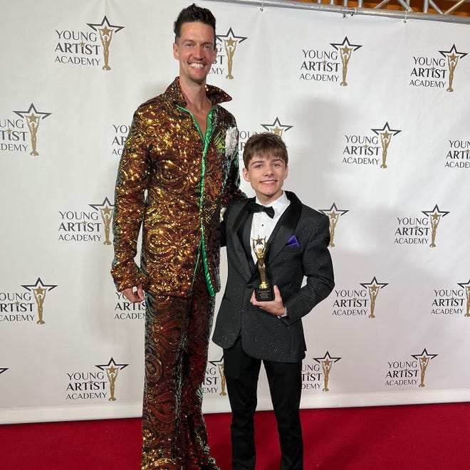 Hartland teen Brayden Eaton, right, poses for photos on the red carpet of the Young Artist Academy awards with actor Dustin Ceithamer, who presented Eaton with an award for his performance in