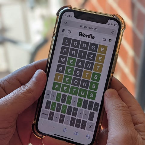 This photo illustration shows a person playing onl