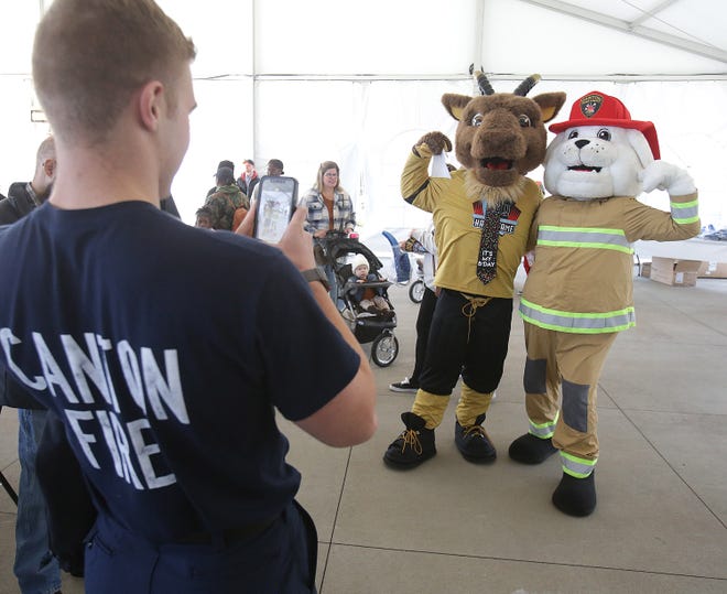 Goldy the G.O.A.T. poses with Canton fire mascot Hydro for a photo taken by Canton firefighter Camden Voarman at Goldy's birthday party celebrated at the Pro Football Hall of Fame.