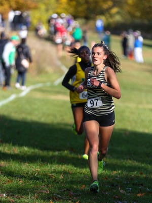 Penn’s Mary Eubank (97) looks around a turn during Saturday's Cross Country Regional at Ox Bow Park in Goshen.