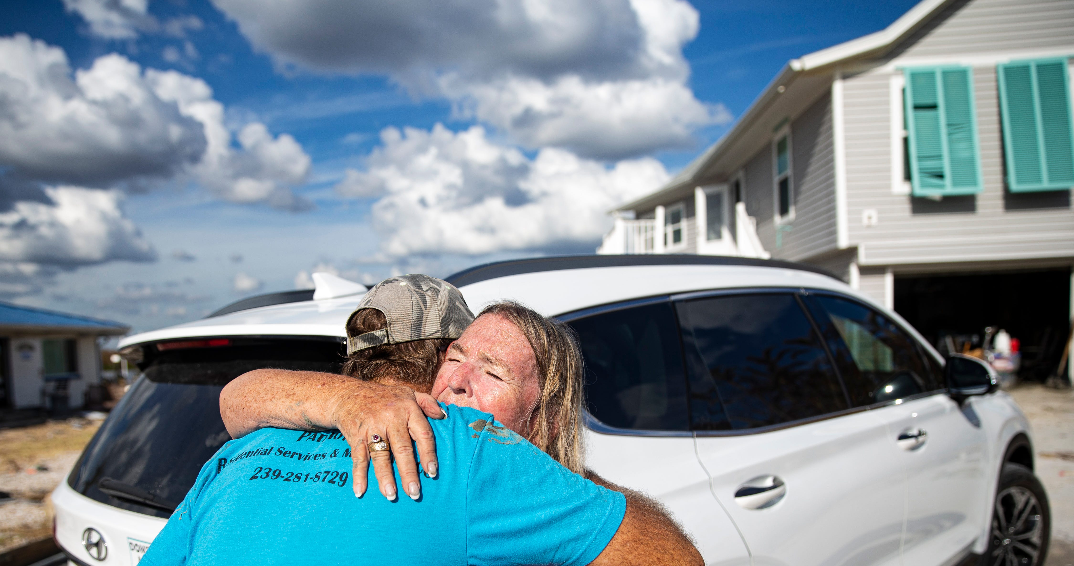 Judi Woods, a resident of Hibiscus Drive on Fort Myers Beach, greets neighbor Bruce Gillikin after seeing damage to her home for the first time. The neighborhood was heavily impacted by Hurricane Ian. Many homes were destroyed and all of them sustained major flooding.