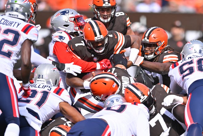 Browns quarterback Jacoby Brissett (7) is stopped by the Patriots defense on a fourth-down run during the first half, Sunday, Oct. 16, 2022, in Cleveland. Brissett came up short and the ball was turned over to New England.