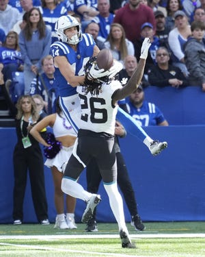 Jacksonville Jaguars' Shaquill Griffin (26) is called for pass interference against Indianapolis Colts' Alec Pierce (14) during the first half of an NFL football game, Sunday, Oct. 16, 2022, in Indianapolis.(AP Photo/AJ Mast)