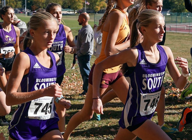 Bloomington South’s Jasmine Martoglio and and Aurelia Martoglio run during the girls’ IHSAA cross country regional at Edgewood on Saturday, Oct. 15, 2022. They both finished within .3 of each other in the top four.