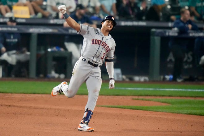 Houston Astros' Jeremy Pena (3) celebrates as he rounds the bases after hitting a home run against the Seattle Mariners during the 18th inning in Game 3 of an American League Division Series baseball game Saturday, Oct. 15, 2022, in Seattle. (AP Photo/Stephen Brashear)